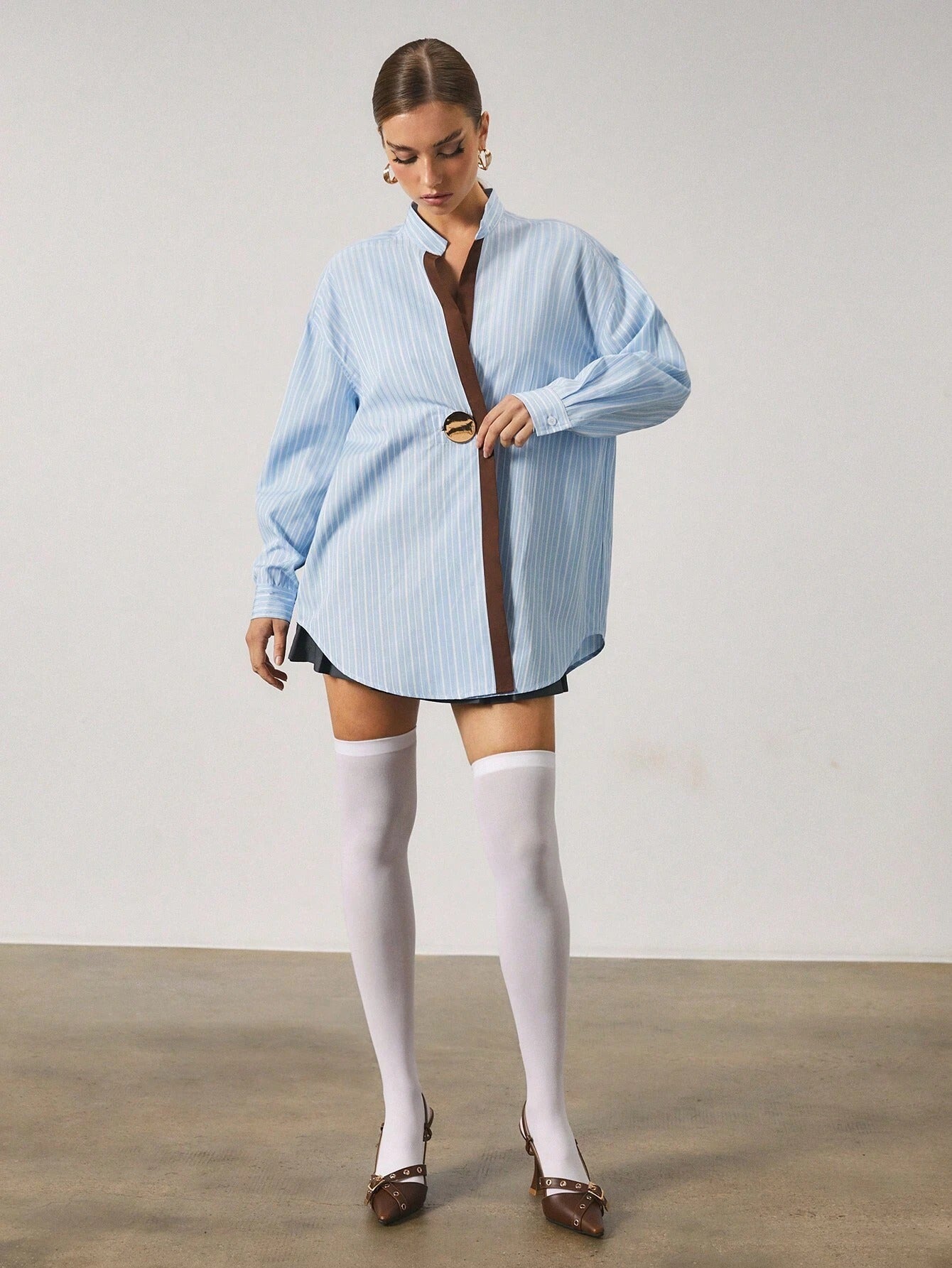 Chemise longue à rayures avec fermeture en métal