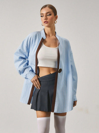 Chemise longue à rayures avec fermeture en métal