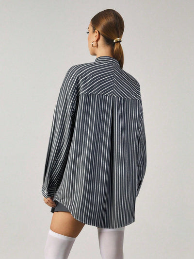 Chemise longue à rayures avec fermeture en métal