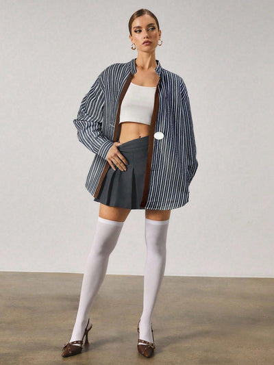 Chemise longue à rayures avec fermeture en métal