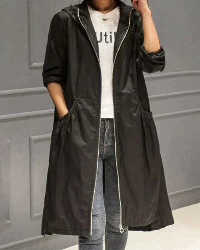 Veste imperméable femme – Coupe ample – Longueur genou – Capuche – Manches longues – Poches fonctionnelles – Fermeture zippée