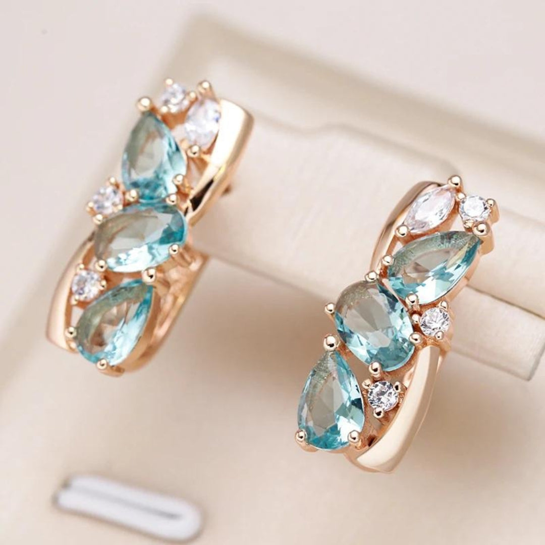 Boucles d'oreilles en or avec zircon bleu