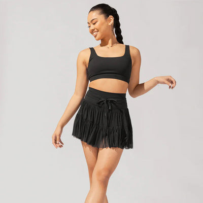 Mini jupe taille haute short intégré plis praticité élégance