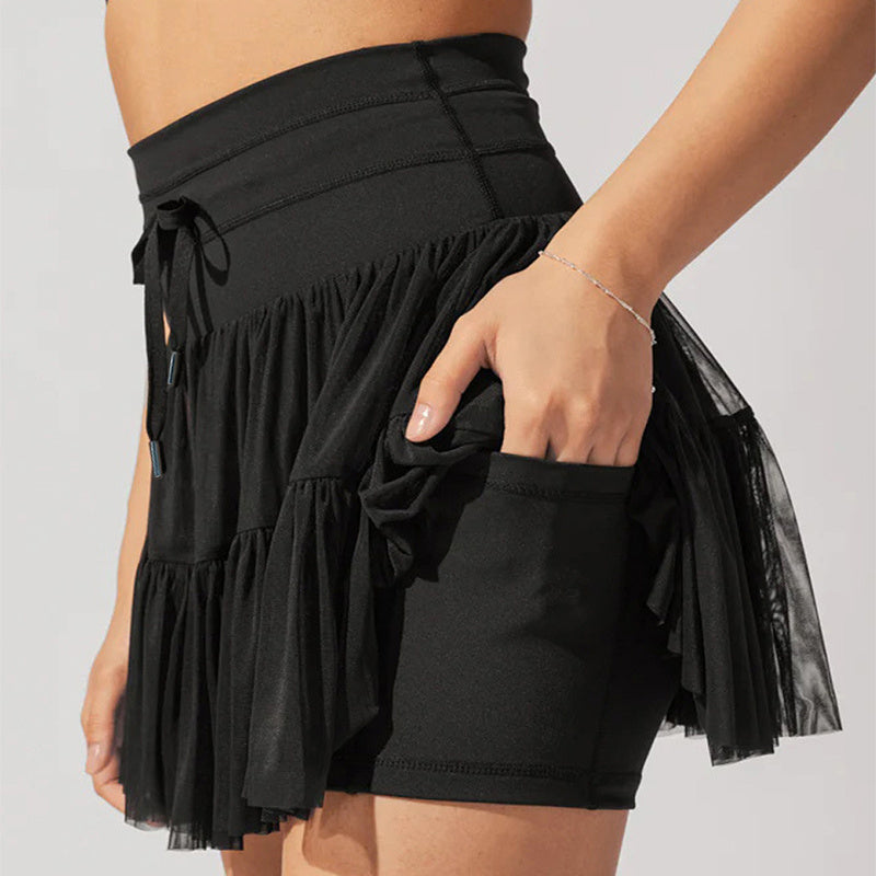 Minijupe taille haute pour femmes avec plis et short intégré