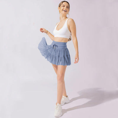 Mini jupe taille haute short intégré plis praticité élégance