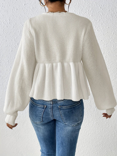Pull blanc avec volants à cordon de serrage à l'ourlet