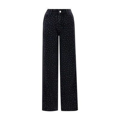 Jean taille haute orné de strass et boutonné sur le côté