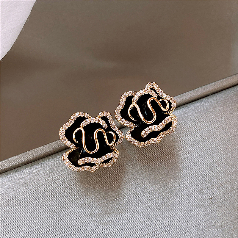 Boucles d'oreilles lotus noires élégantes avec éléments scintillants