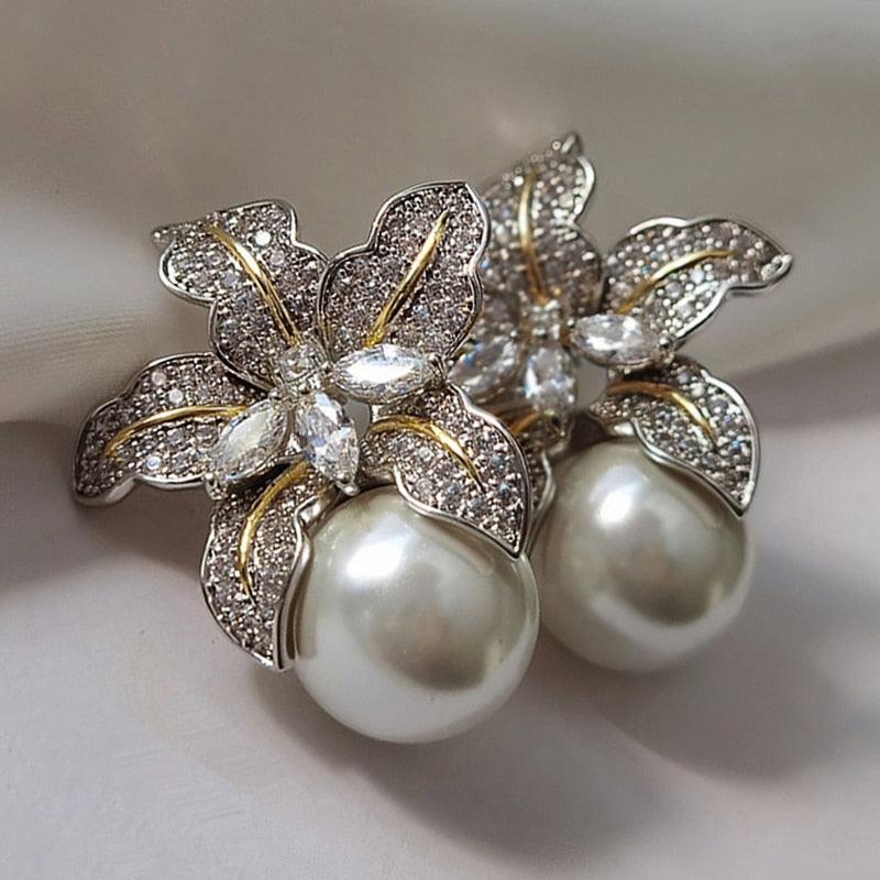 Boucles d'oreilles élégantes en fleurs avec paillettes et perle