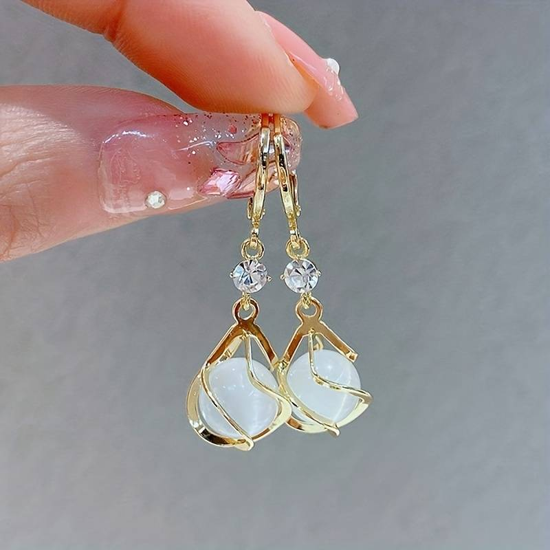 Boucles d'oreilles avec opale blanche