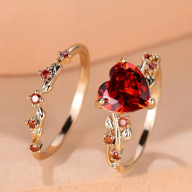 Ensemble de boucles d'oreilles avec cristaux rouges et cœur